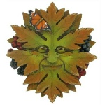 Green Man Nature shows his face emerging from the leaves with a butterfly